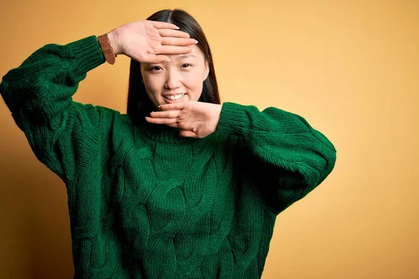 Young Beautiful Asian Woman Wearing Green Winter Sweater Yellow Isolated — Stock Photo, Image