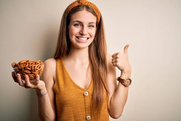 Young Beautiful Redhead Woman Holding Bowl German Baked Pretzels Happy — Stock Photo, Image