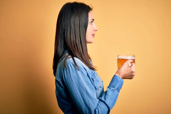 Young Woman Blue Eyes Drinking Jar Beer Standing Isolated Yellow — Stock Photo, Image