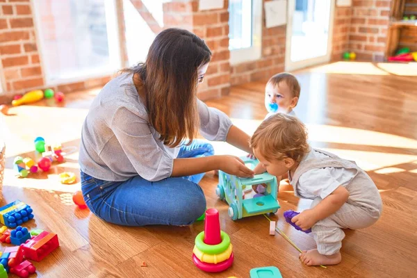 Beautiful Teacher Toddlers Playing Lots Toys Kindergarten — Stock Photo, Image