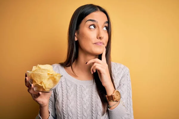 Young Beautiful Brunette Woman Holding Bowl Snack Potato Chips Yellow — Stock Photo, Image