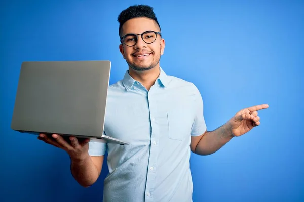 Young Handsome Businessman Wearing Glasses Working Using Laptop Blue Background — Stock Photo, Image