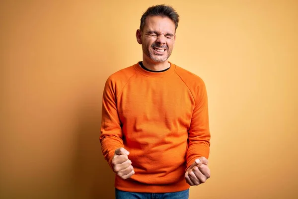 Young Handsome Man Wearing Orange Casual Sweater Standing Isolated Yellow — Stock Photo, Image