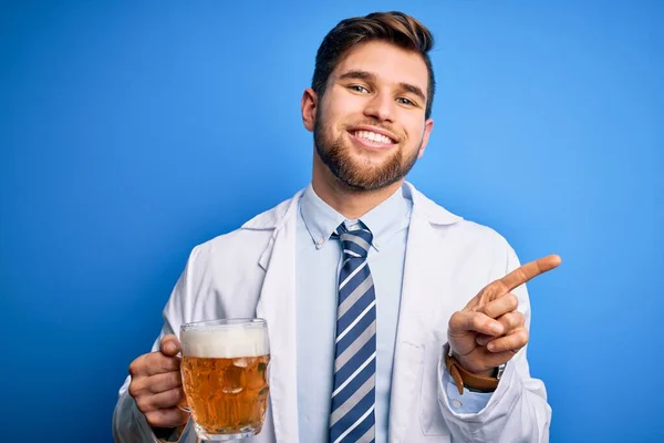 Young Blond Doctor Man Beard Blue Eyes Wearing Coat Drinking — Stock Photo, Image