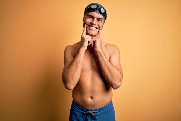 Young Handsome Man Shirtless Wearing Swimsuit Swim Cap Isolated Yellow — Stock Photo, Image