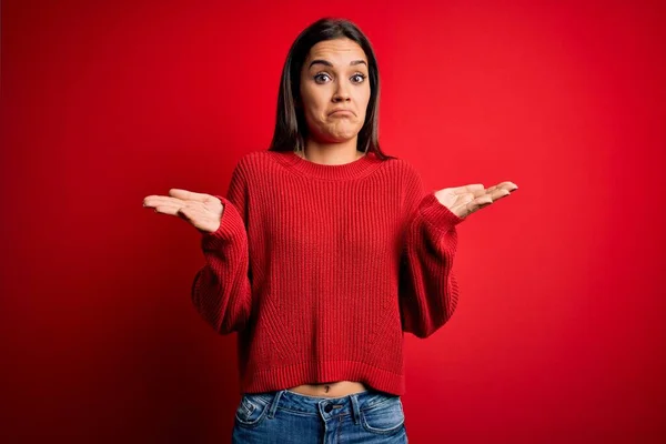 Beautiful Young Brunette Woman Wearing Casual Sweater Standing Red Isolated — Stock Photo, Image