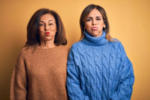 Middle Age Beautiful Couple Sisters Wearing Casual Sweater Isolated Yellow — Stock Photo, Image