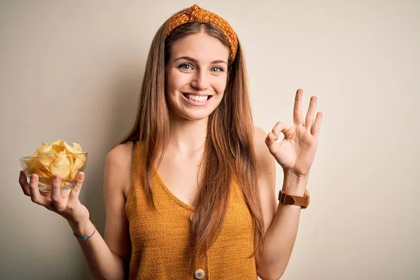 Young Beautiful Redhead Woman Holding Bowl Potato Chips Isolated White — Stock Photo, Image