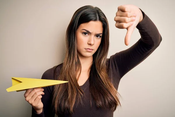 Young Beautiful Girl Holding Paper Plane Standing Isolated White Background — Stock Photo, Image