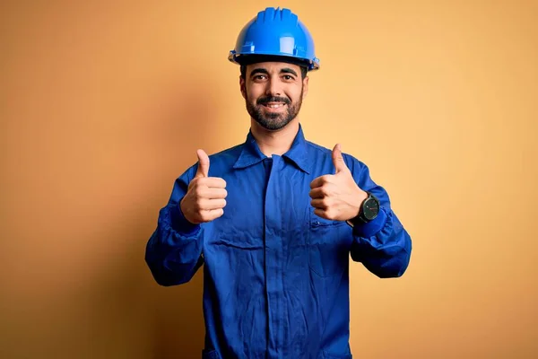 Mechanic Man Beard Wearing Blue Uniform Safety Helmet Yellow Background — Stock Photo, Image