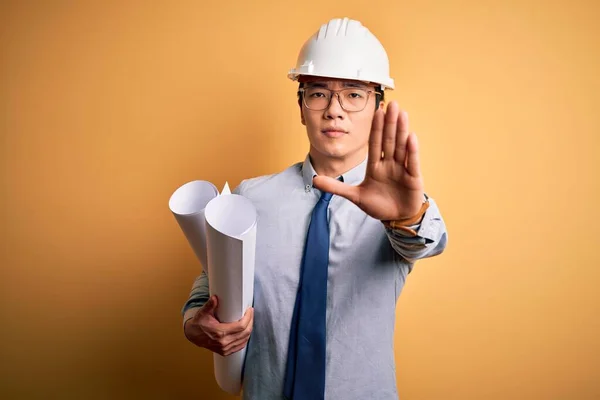 Young Handsome Chinese Architect Man Wearing Safety Helmet Holding Blueprints — Stock Photo, Image