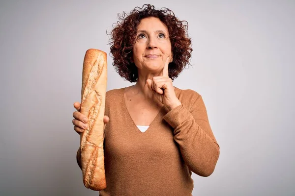 Middle Age Curly Hair Woman Holding Fresh Homemade Bread Isolated — Stock Photo, Image