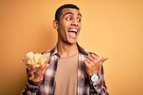 Young Handsome African American Man Holding Bowl Chips Potatoes Yellow — Stock Photo, Image