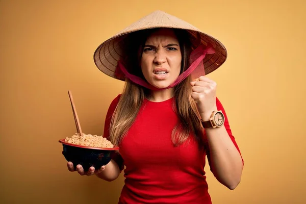 Young Woman Wearing Asian Hat Eating Chinese Noodles Yellow Isolated — Stock Photo, Image