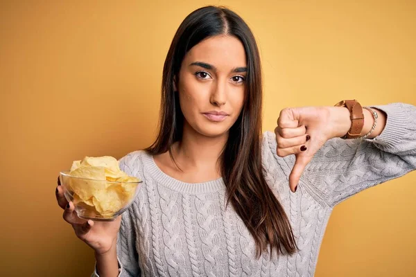 Young Beautiful Brunette Woman Holding Bowl Snack Potato Chips Yellow — Stock Photo, Image