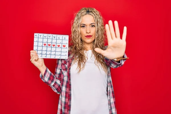 Young Beautiful Blonde Woman Holding Period Calendar Controlling Menstrual Cycle — Stock Photo, Image