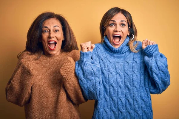 Middle Age Beautiful Couple Sisters Wearing Casual Sweater Isolated Yellow — Stock Photo, Image