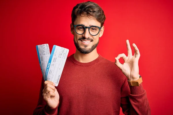 Young Tourist Man Vacation Holding Boarding Pass Standing Red Bakground — Stock Photo, Image