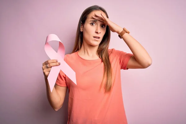 Young Beautiful Woman Holding Pink Cancer Ribbon Standing Isolated Pink — Stock Photo, Image