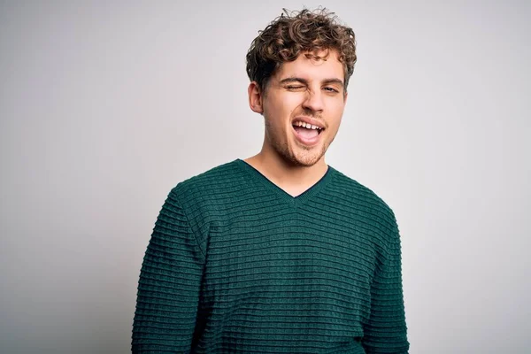 Young Blond Handsome Man Curly Hair Wearing Green Sweater White — Stock Photo, Image