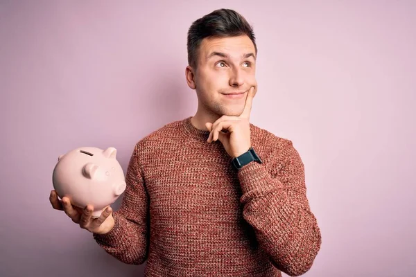 Young Handsome Caucasian Man Holding Piggy Bank Savings Pink Background — Stock Photo, Image