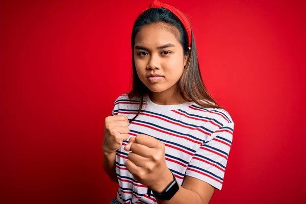 Young Beautiful Asian Girl Wearing Casual Striped Shirt Isolated Red — Stock Photo, Image