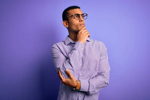 Handsome African American Man Wearing Striped Shirt Glasses Purple Background — 图库照片