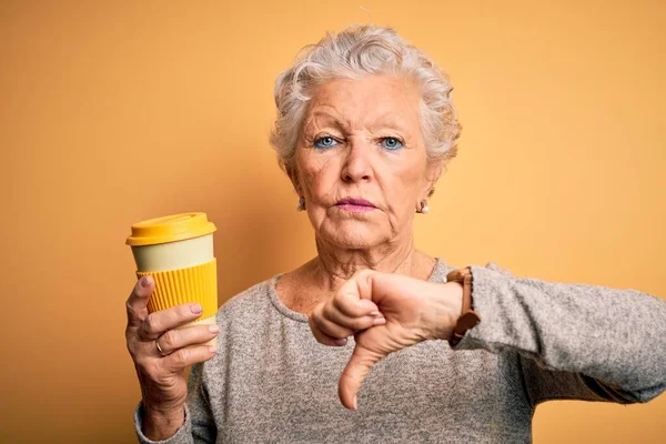 Senior Beautiful Woman Drinking Cup Coffee Standing Isolated Yellow Background — Stock Photo, Image