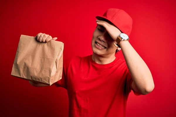 Young Handsome Chinese Delivery Man Holding Takeaway Paper Bag Food — Stock Photo, Image