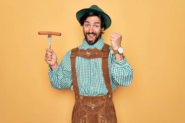 Young Handsome Man Wearing Tratidional German Octoberfest Custome Eating Sausage — Stock Photo, Image
