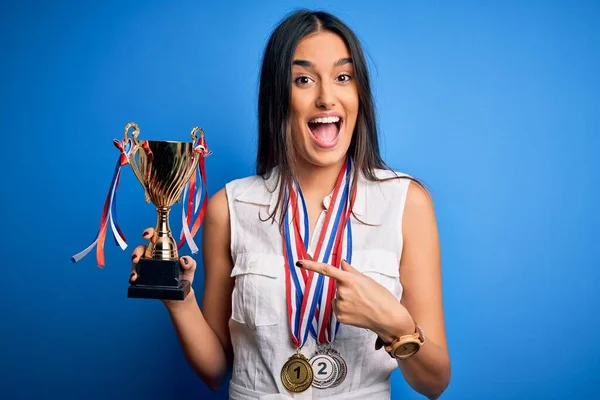 Young Beautiful Brunette Successful Woman Wearing Medals Holding Trophy Very — Stock Photo, Image