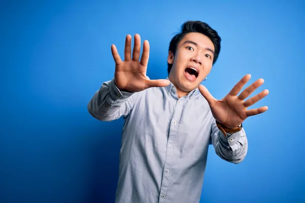 Young Handsome Chinese Man Wearing Casual Shirt Standing Isolated Blue — Stock Photo, Image