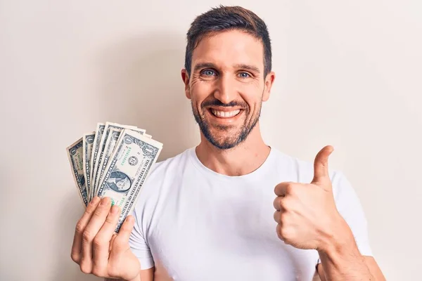 Joven Hombre Guapo Sosteniendo Montón Billetes Dólares Sobre Fondo Blanco —  Fotos de Stock