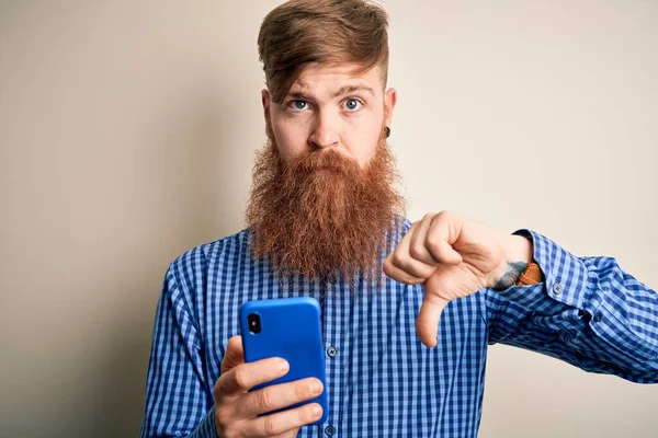 Redhead Irish Man Beard Using Smartphone Looking Screen Isolated Background —  Fotos de Stock