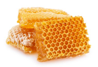 Beyaz arkaplanda bal olan bal peteği