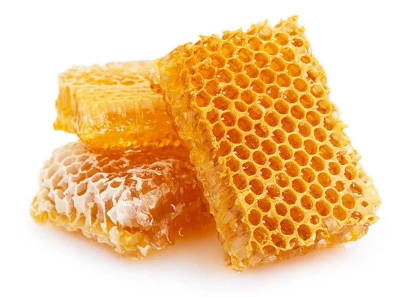 Nid d'abeille avec du miel sur fond blanc — Photo
