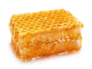 Beyaz arkaplanda bal olan bal peteği