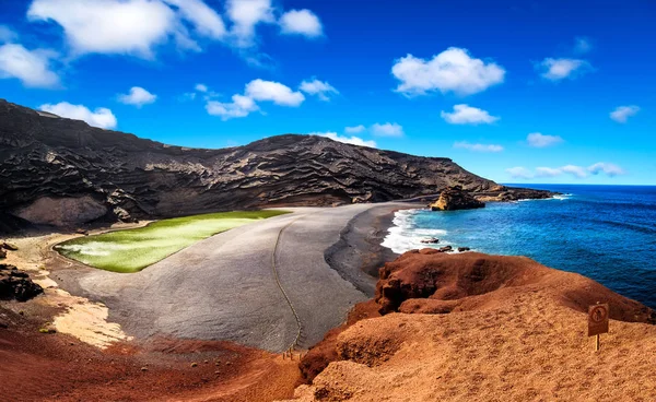 View into a volcanic crater with its green lake near El Golfo Stock Image