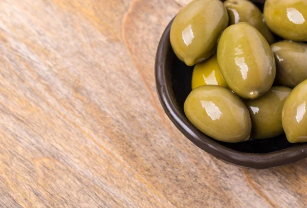 Giant green olives in olive bow — Stock Photo, Image