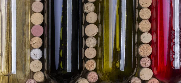 Glass bottle of wine with corks — Stock Photo, Image