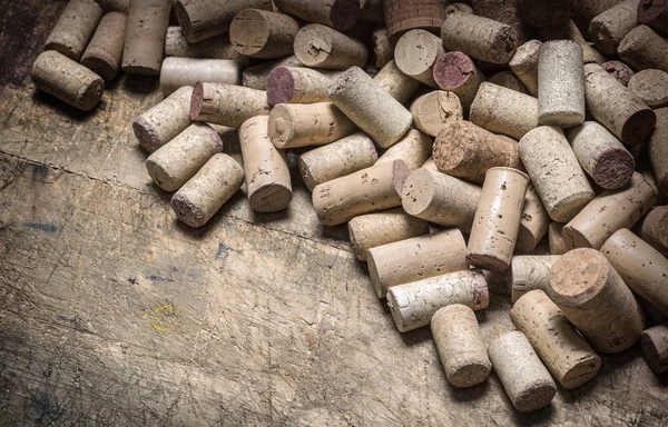 Wine corks on wooden table — Stock Photo, Image