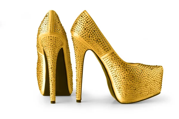 stock image gold shoes isolated