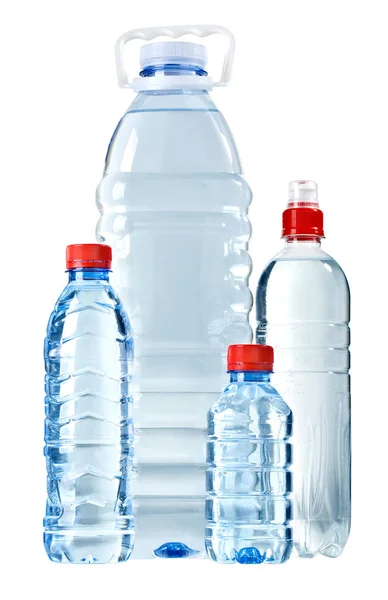 Бутылки с водой на белом — стоковое фото