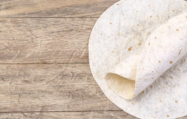Tortilla on wooden table — Stock Photo, Image