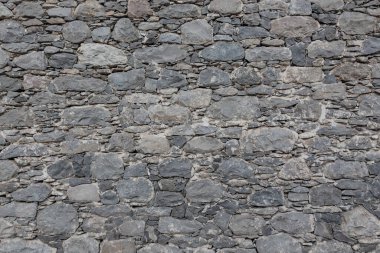 Gri taş duvar dokusunun arkaplanı