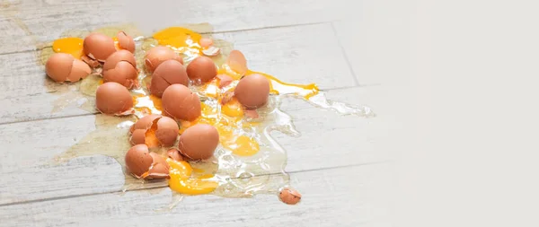 Eggs broken on the  floor background