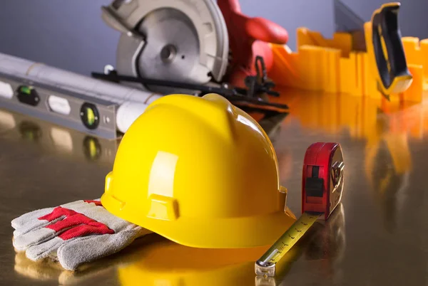Construction Gear on Gold Tabletop with Hardhat — Stock Photo, Image