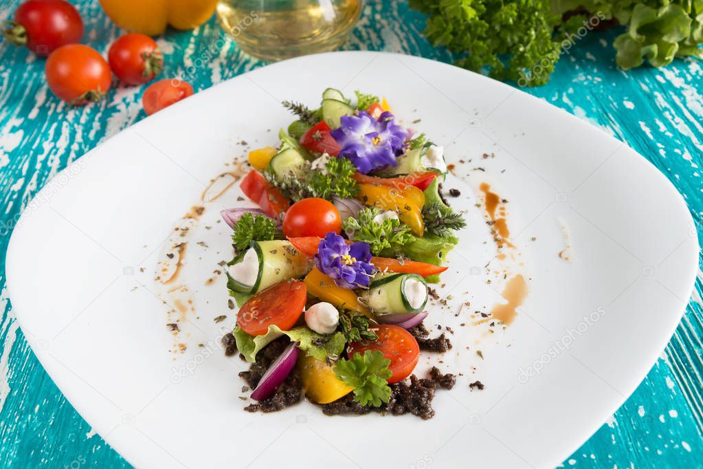 Greek salad fresh vegetables with feta cheese and grated black o