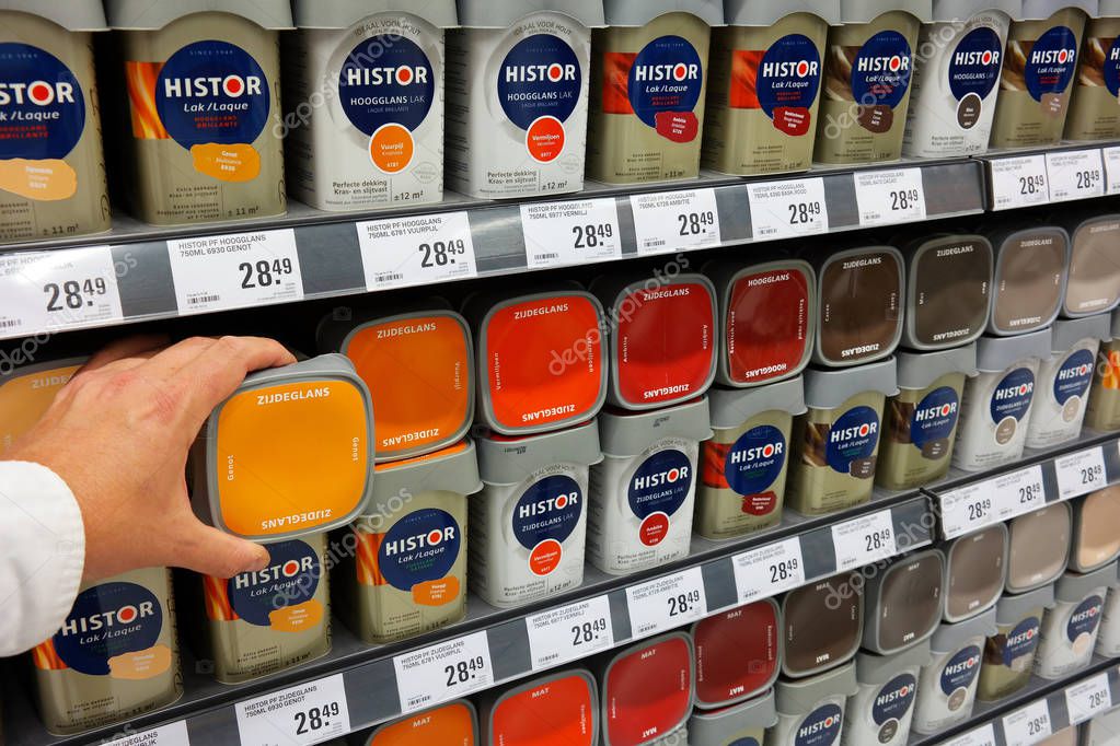 THE NETHERLANDS - OCTOBER 2015: Range of paint cans in the paint department of a Hardware store. Coatings and paints group AkzoNobel has rejected a takeover bid by its US rival PPG industries.