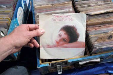 THE NETHERLANDS - APRIL 2018: Single record of the James Bond movie theme  For Your Eyes Only performed by Scottish-American singer Sheena Easton. clipart